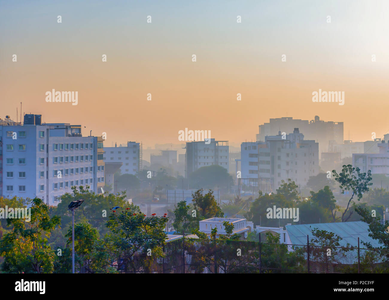 The cityscape and landscape of Kondapur and Hi-Tech city, Hyderabad, Telangana, India, under a shroud of early morning mist, late December. Stock Photo