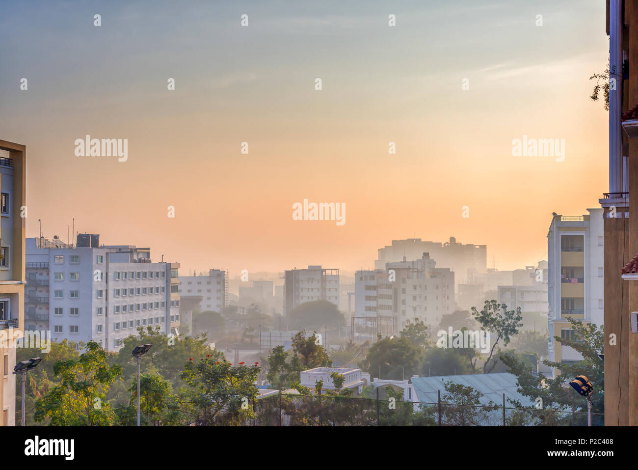 The cityscape and landscape of Kondapur and Hi-Tech city, Hyderabad, Telangana, India, under a shroud of early morning mist, late December. Stock Photo