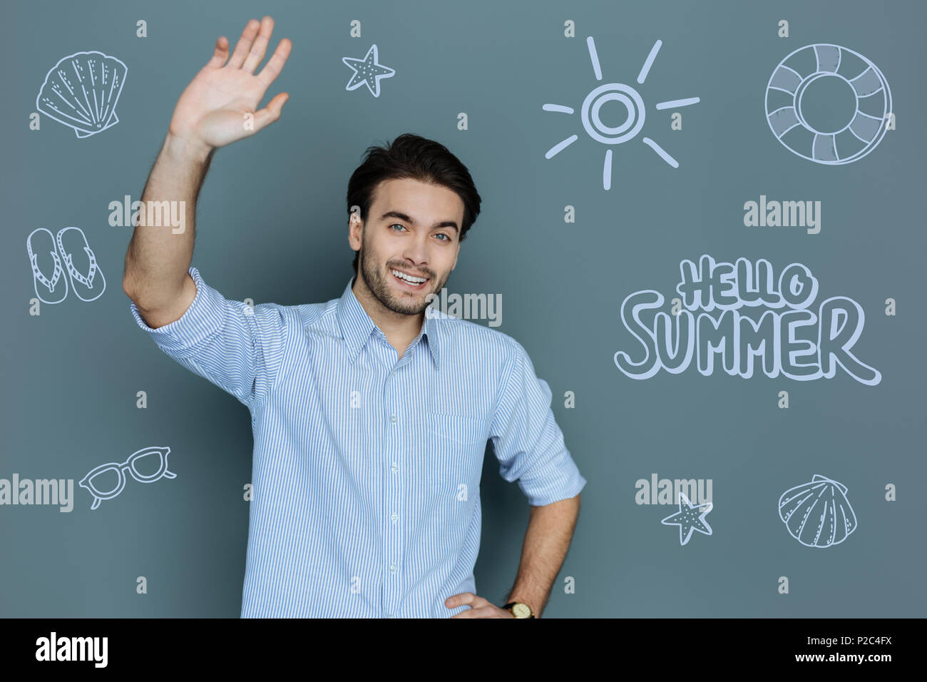 Tourist entertainer smiling and waving his hand Stock Photo