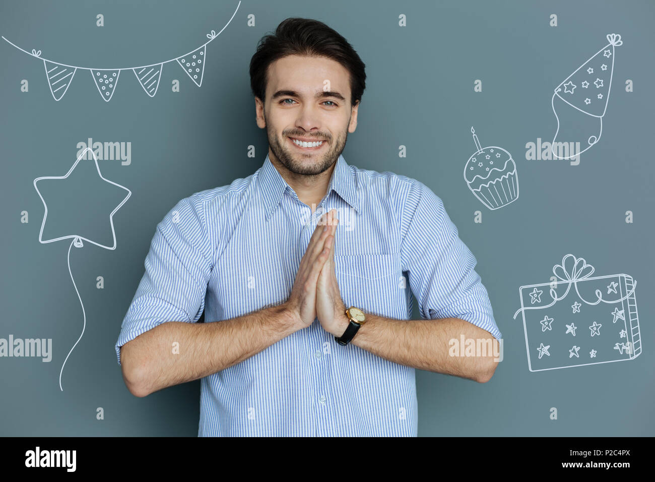 Positive man feeling happy while having a birthday party Stock Photo