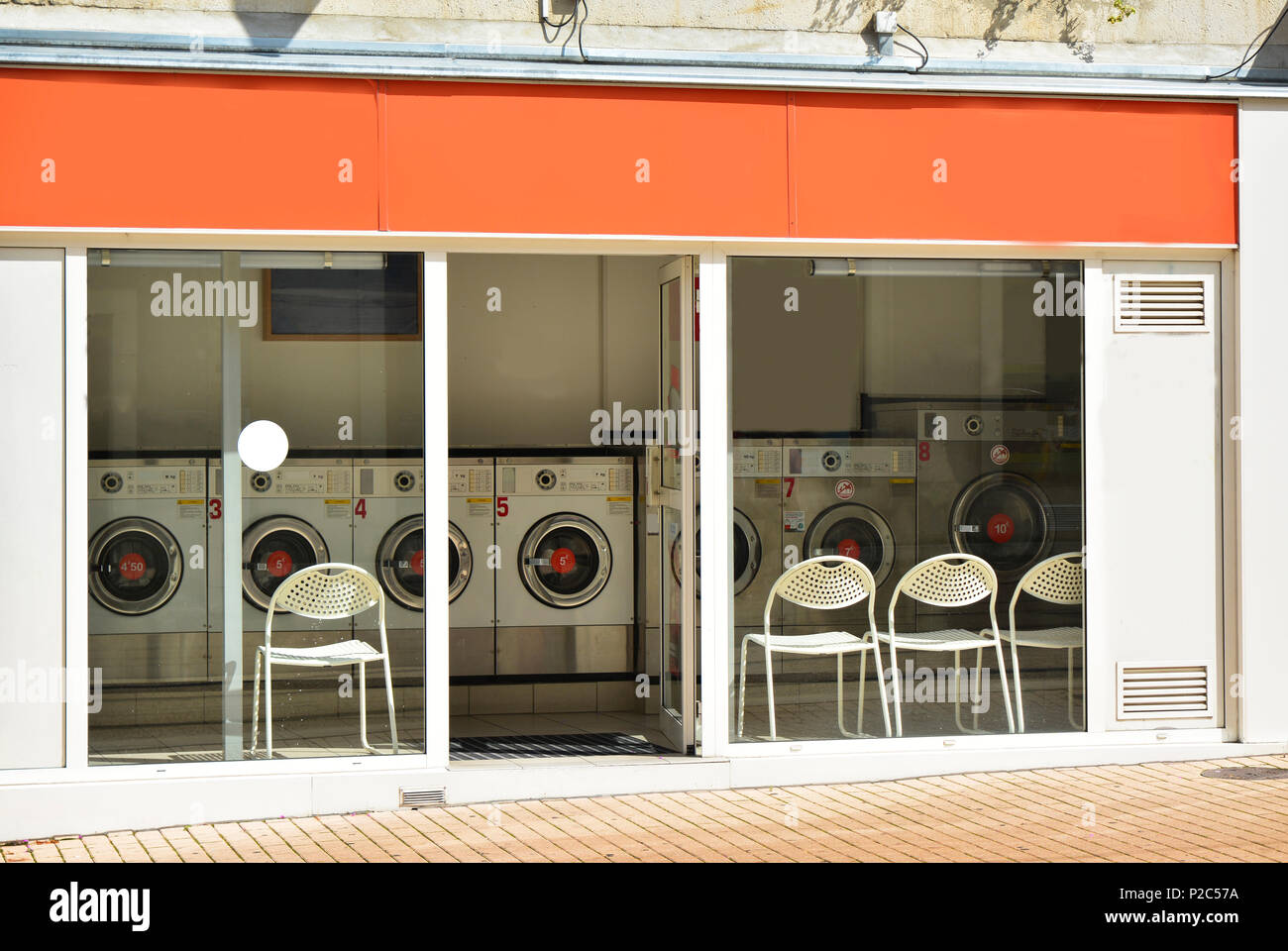 Coin laundry in a building in the city outside Stock Photo Alamy