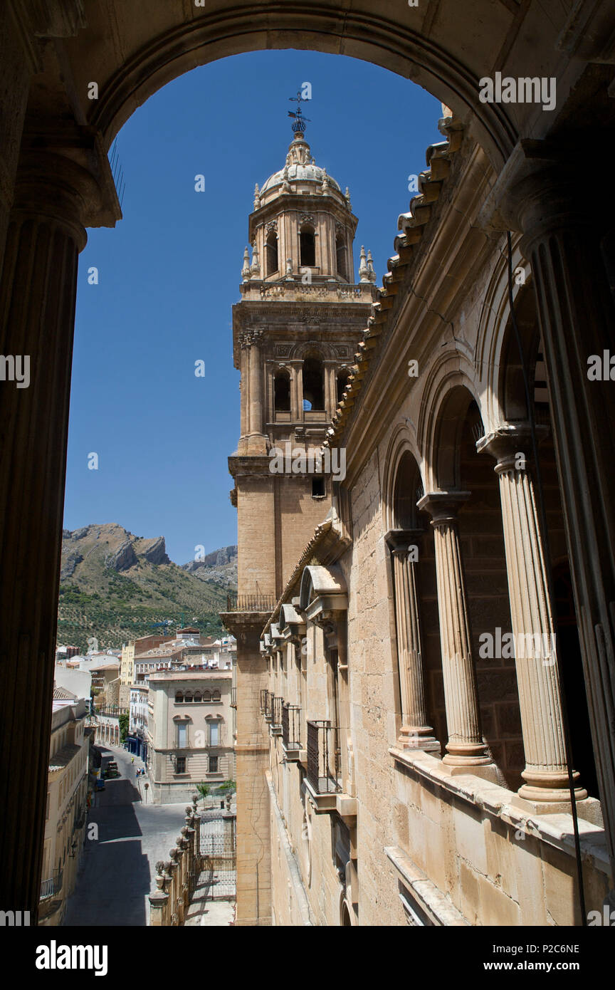 View out of a window in the cathedral to the tower and the mountains above Jaen, Jaen province, Andalusia, Spain Stock Photo