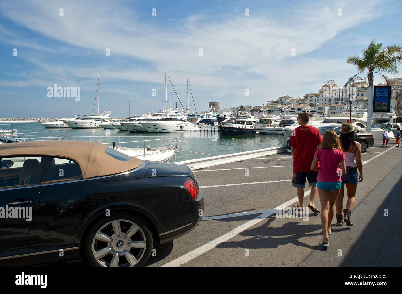 Luxury car and yachts in the Yacht harbour of Marbella, Puerto Banus, Malaga probince, Andalusia, Spain Stock Photo