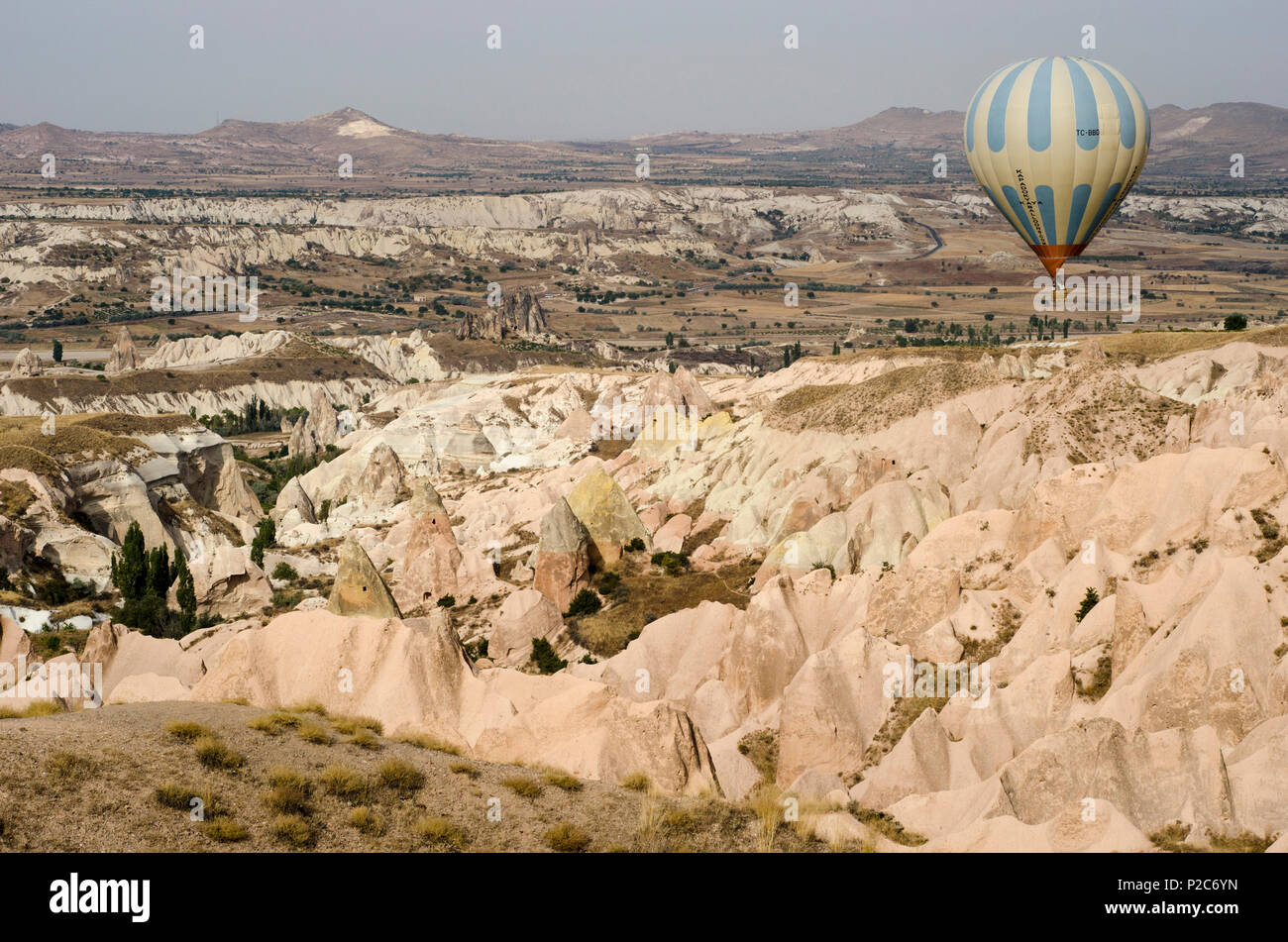 A Balloon above the bizarre landscapes of Cappadocia, Turkey Stock Photo