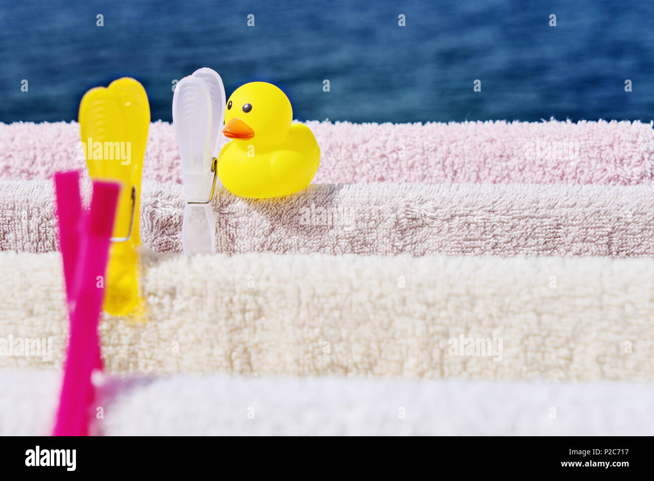 Fresh clean towels drying on washing line in outdoor. Laundry hangs on