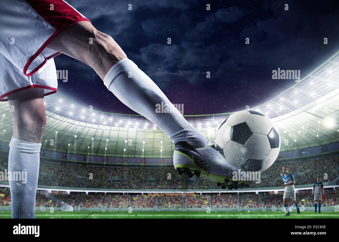 Soccer player with soccerball at the stadium ready for the match Stock Photo
