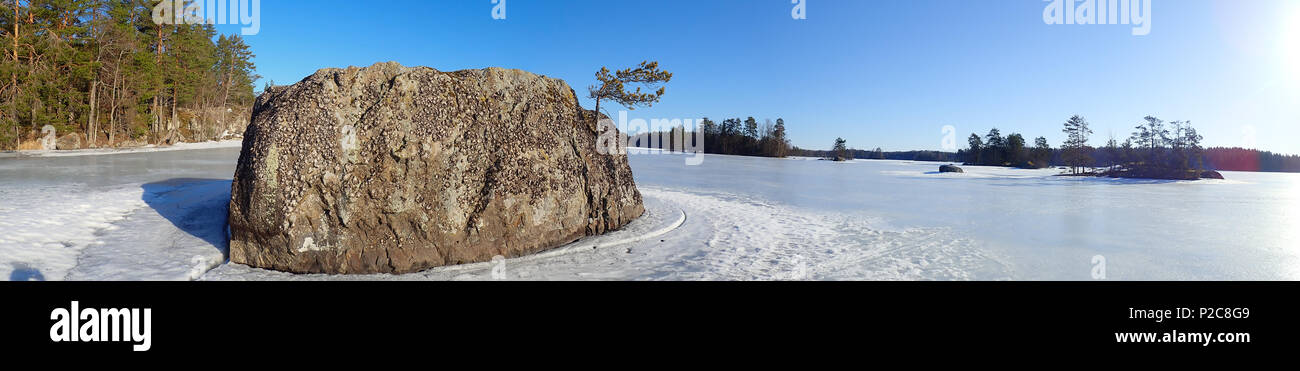 Large rock on Lake Kukkia. Luopioinen, Finland. 11.4.2018 Stock Photo