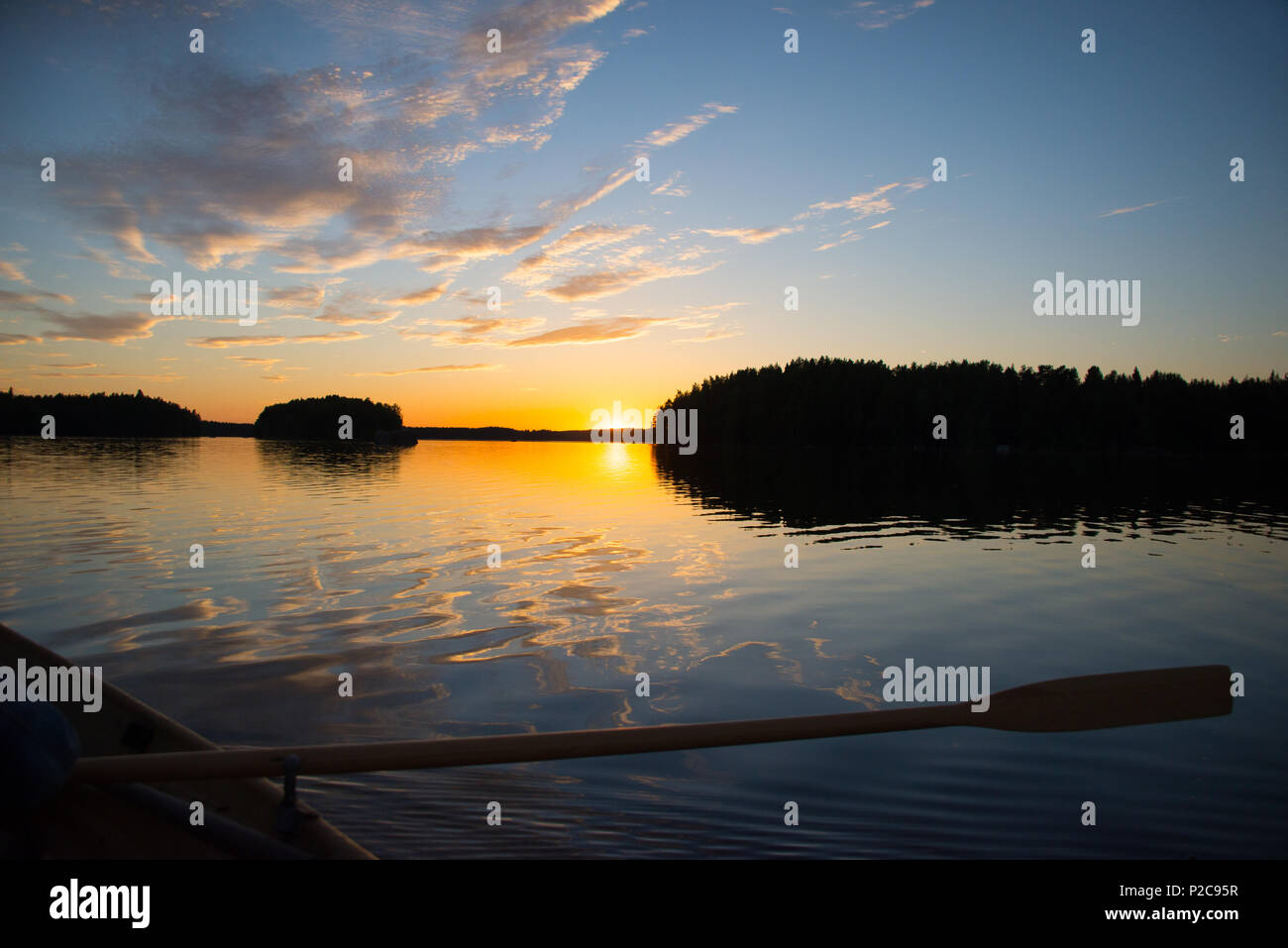 Sunset reflections. Lake Kukkia, Luopioinen, Finland. 24.6.2018 Stock Photo