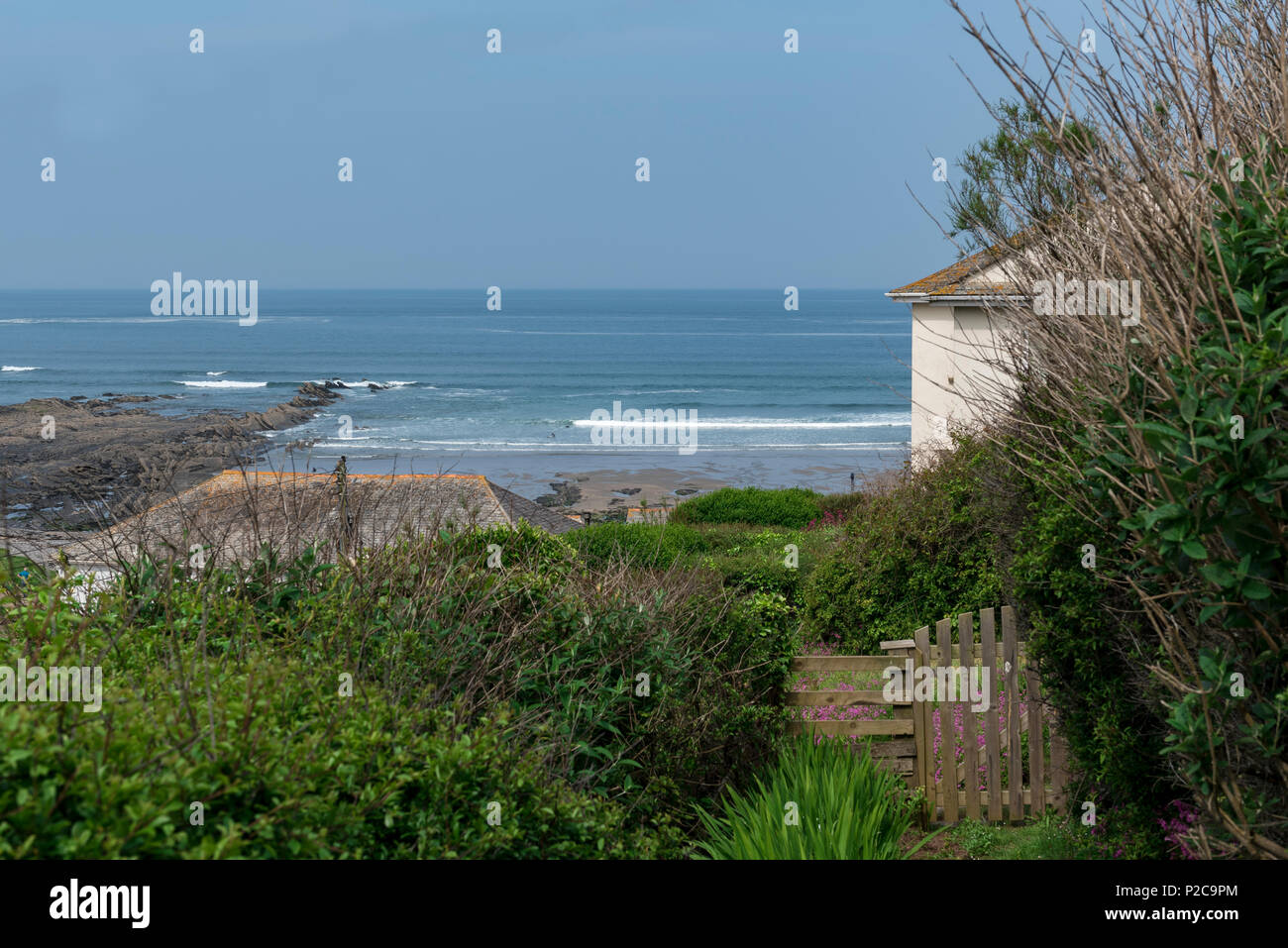 Cottage with a glorious seaview as seen from a section of the south west coast path at Crackington Haven Cornwall. Stock Photo