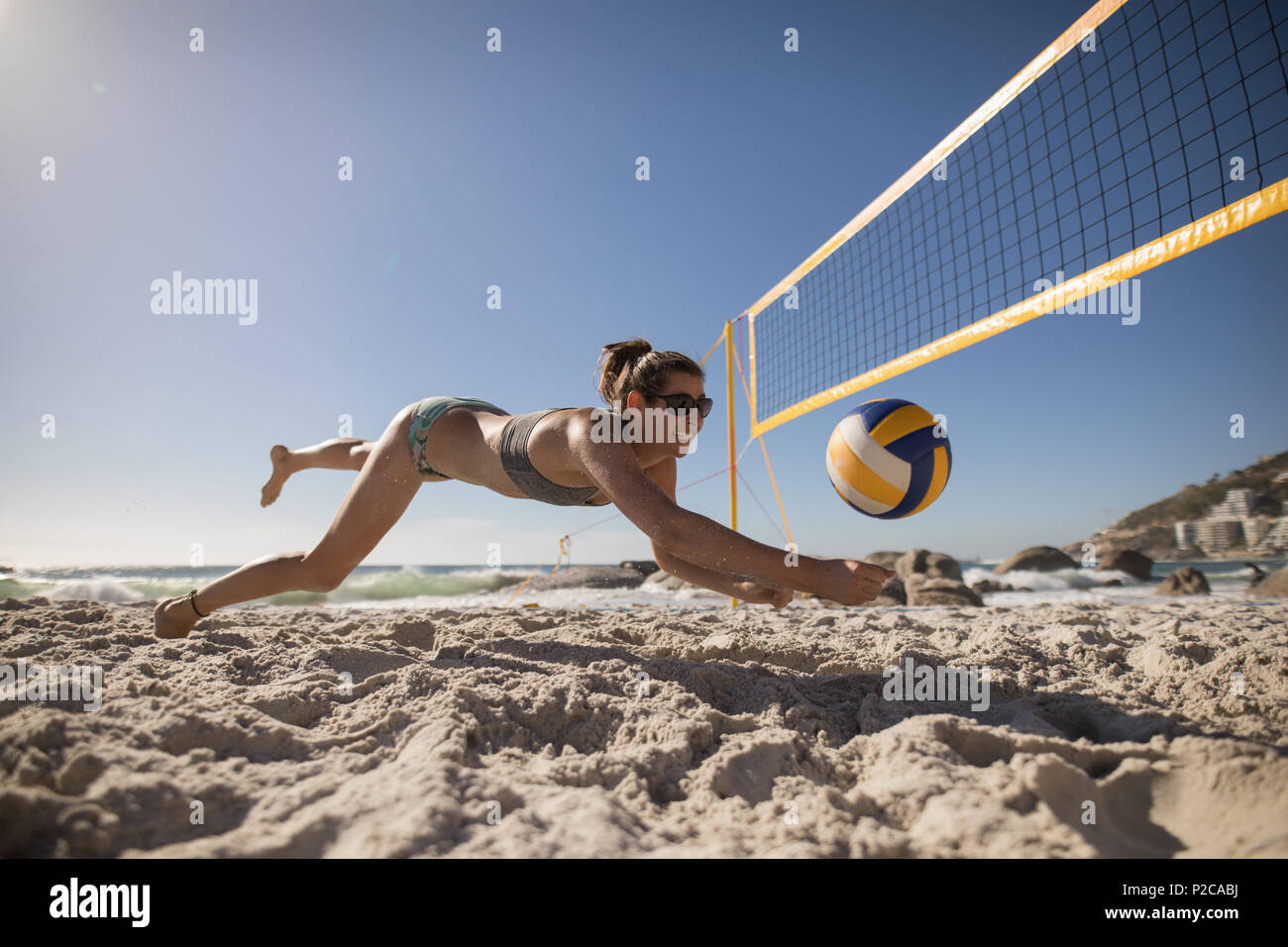 Female volleyball player playing football Stock Photo