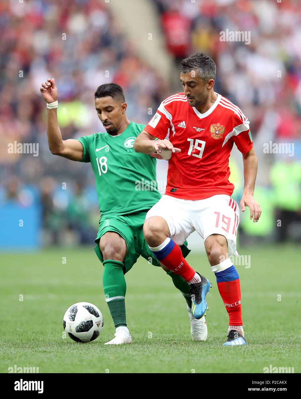 Saudi Arabia's Salem Al-Dawsari (left) and Russia's Aleksandr Samedov battle for the ball during the FIFA World Cup 2018, Group A match at the Luzhniki Stadium, Moscow. Stock Photo