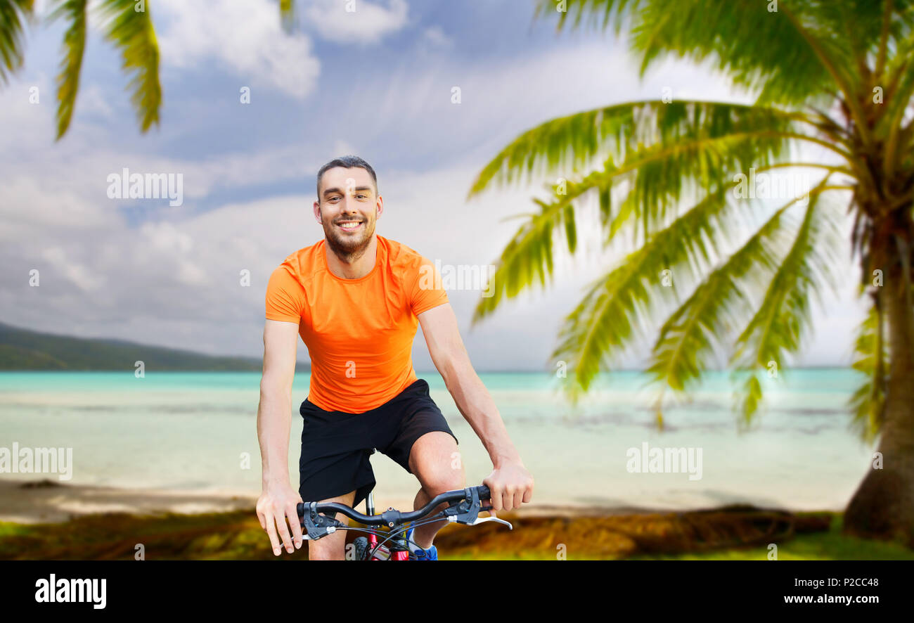 Hispanic Man Riding Bike Hispanic man riding bike beach hi-res stock photography and images - Alamy