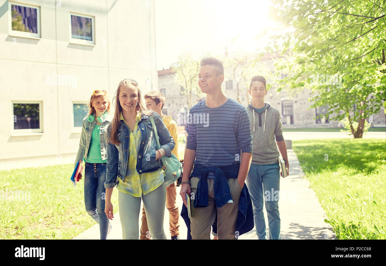 group of happy teenage students walking outdoors Stock Photo - Alamy