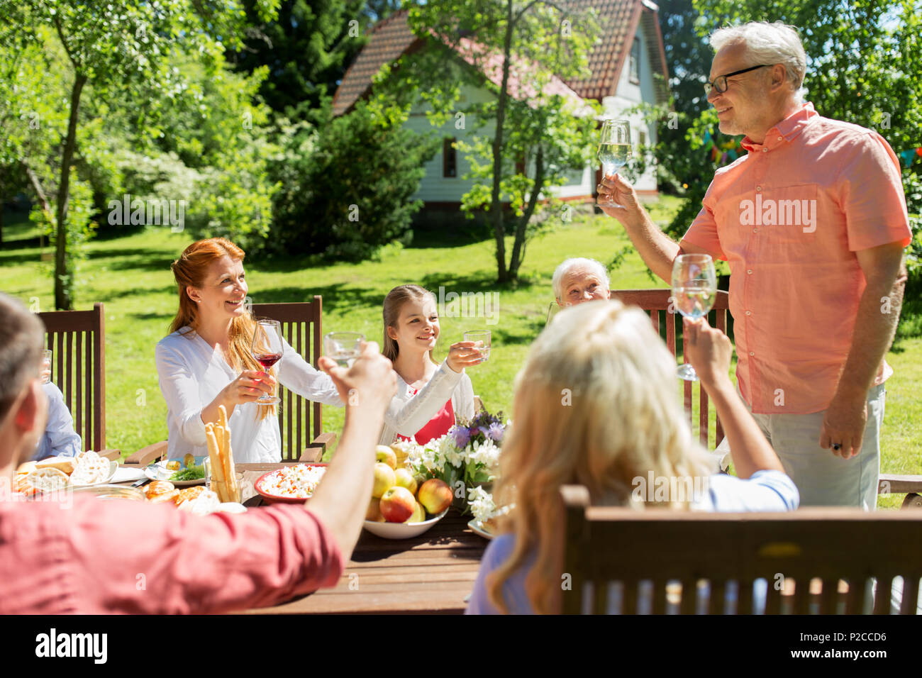 family gathering at summer garden and celebration Stock Photo