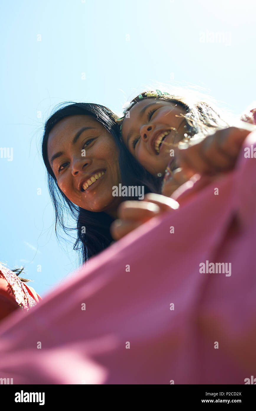 Malay Mother And Her Two Young Daughters Wearing Traditional Baju Kurung Dresses Smiling Happily Into Camera During Hari Raya Celebration Stock Photo Alamy
