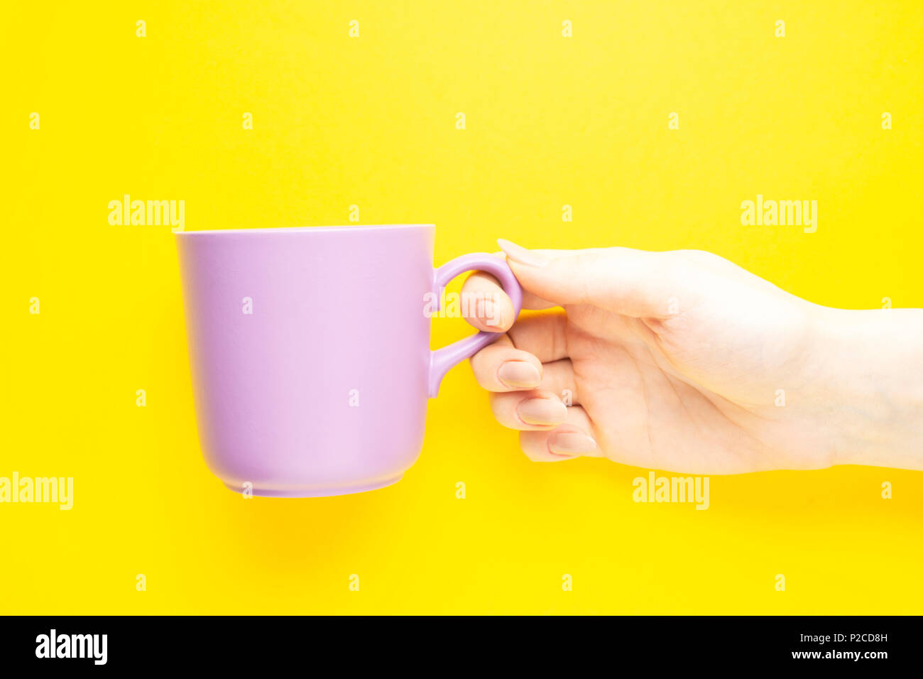 Download Creative Concept Photo Of Hand Holding Coffee Cup On Yellow Background Stock Photo Alamy Yellowimages Mockups