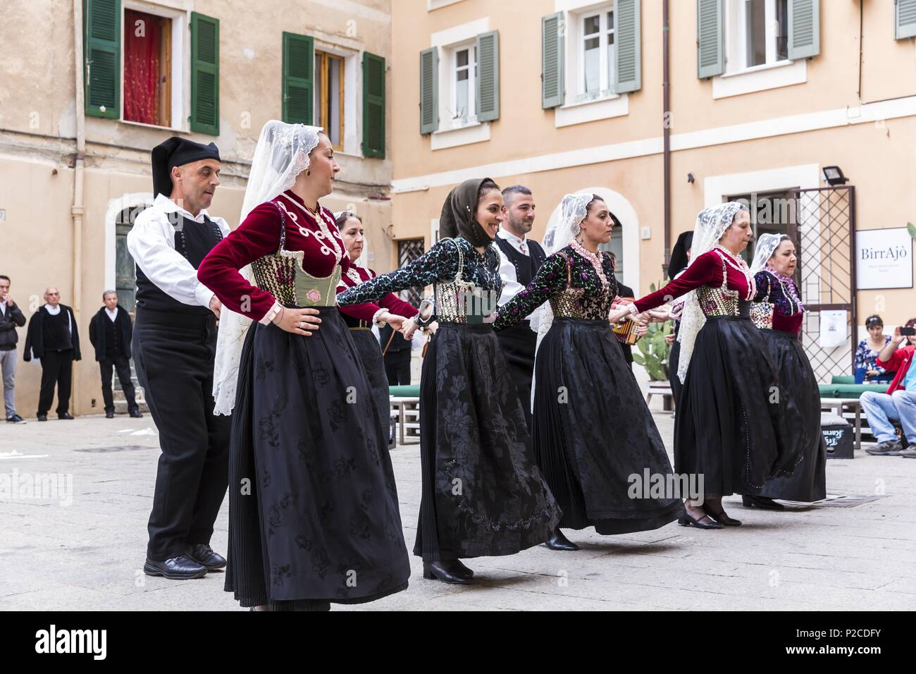 Italy, Sardinia, Western Sardinia, Alghero, Carrer de la Merce, native folk  troop place piazza Santa Caterina Stock Photo - Alamy