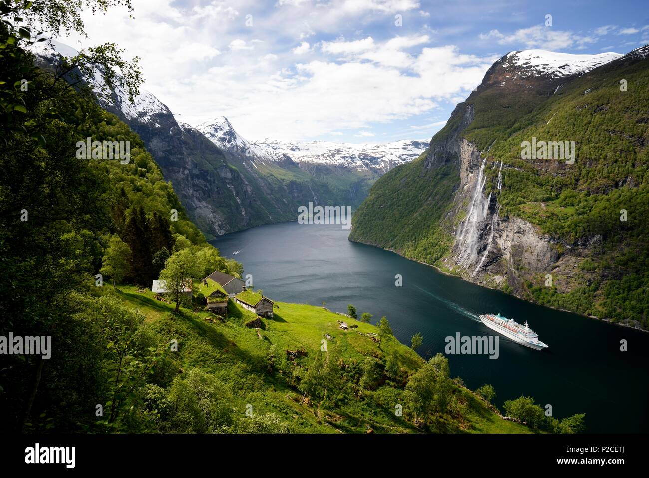 Norway, More og Romsdal, Geiranger fjord (Geirangerfjord), listed as World Heritage by UNESCO, hike to the Skagefla, a historic mountain farm, cruise ship on the fjord and Seven Sisters waterfall Stock Photo