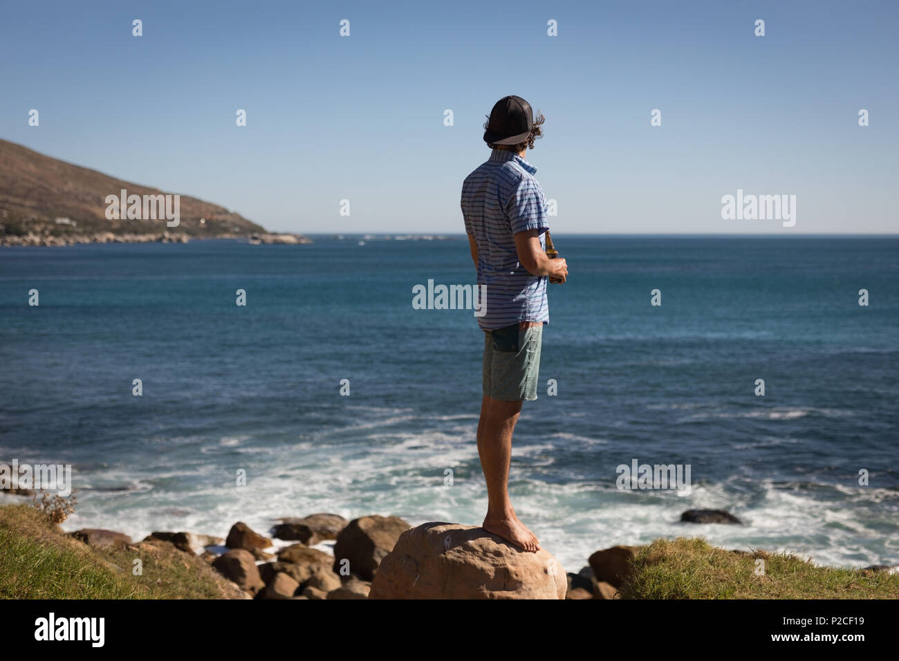 Man standing on the beach Stock Photo