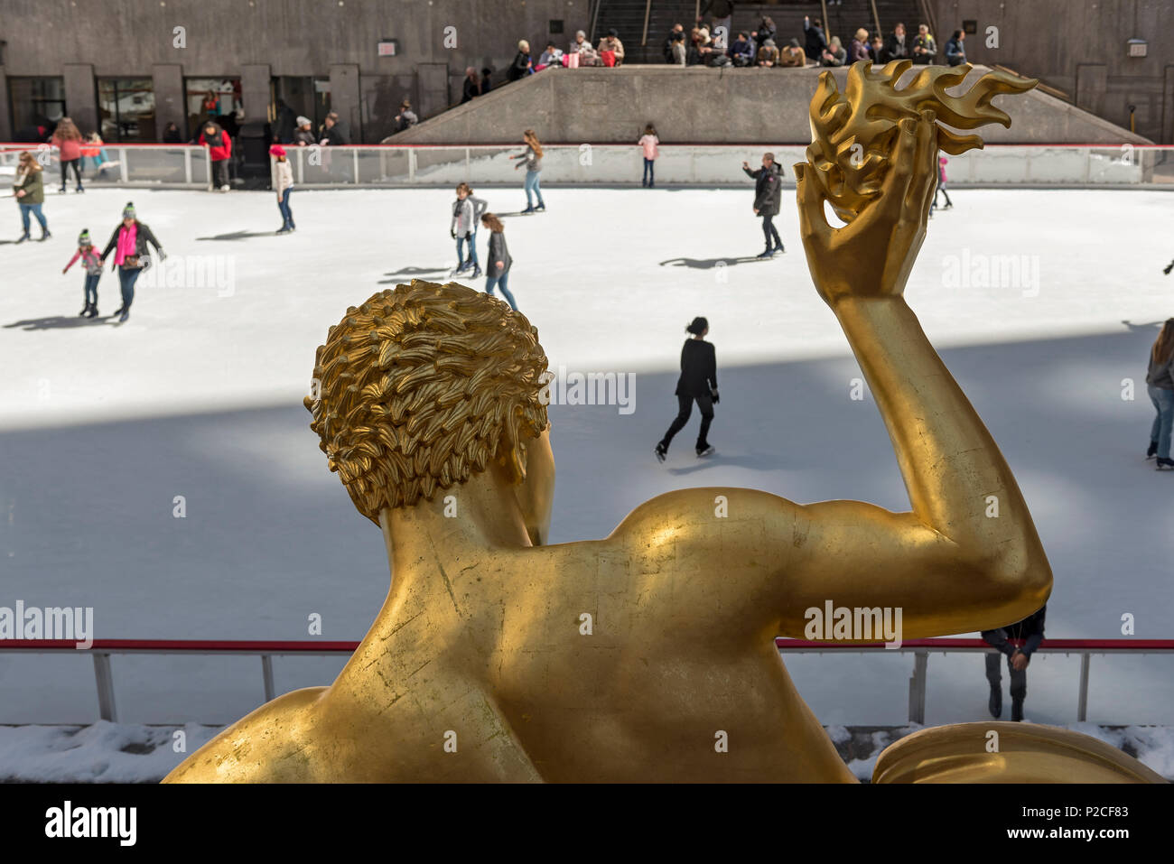 Prometheus sculpture by Paul Manship and ice rink at Rockefeller Center in Manhattan, New York City, USA Stock Photo
