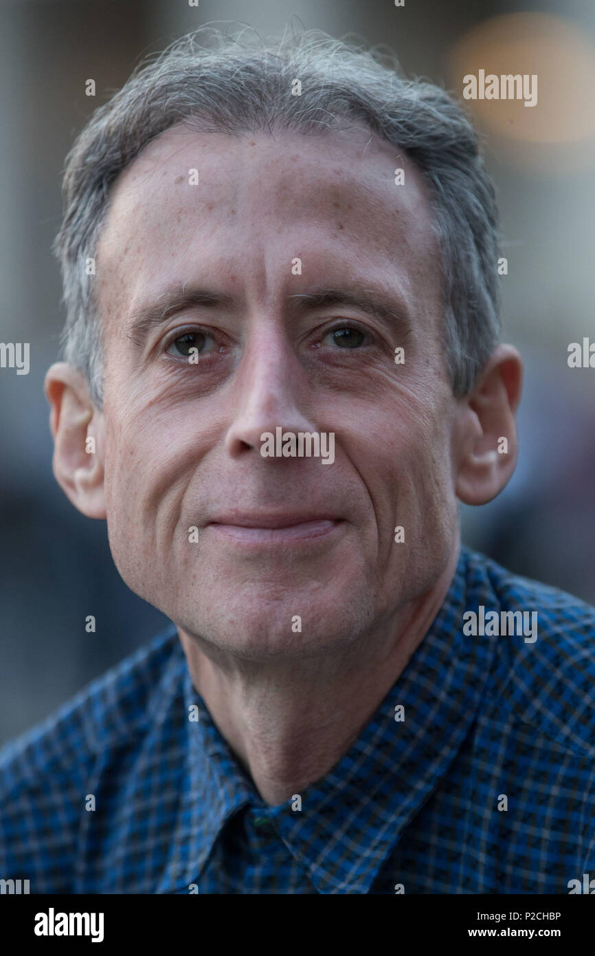 Gay rights campaigner Peter Tatchell sits in Manezhnaya Square, Moscow, where he was earlier led away from after staging a one-man protest. Stock Photo