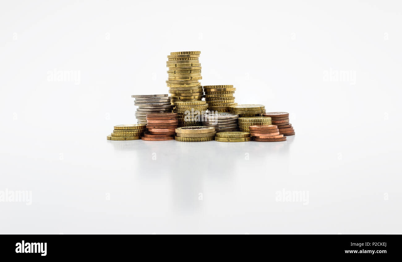 Stack of gold and silver coins isolated on white background with ...