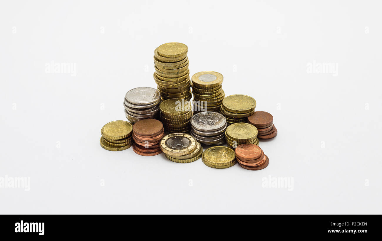 Stack of gold and silver coins isolated on white background with ...