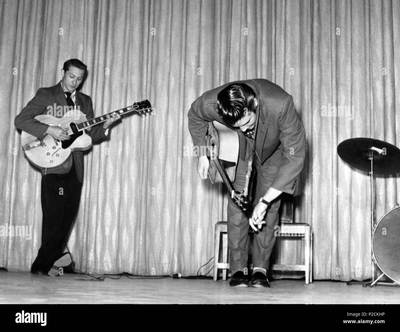 The American singer Elvis Presley perfoming in the 1950´s with the American guitarist Scotty Moore. Stock Photo
