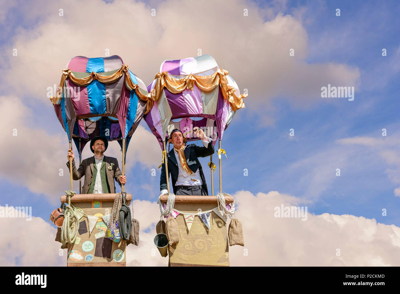 Two street entertaines in mock hot air balloons Stock Photo