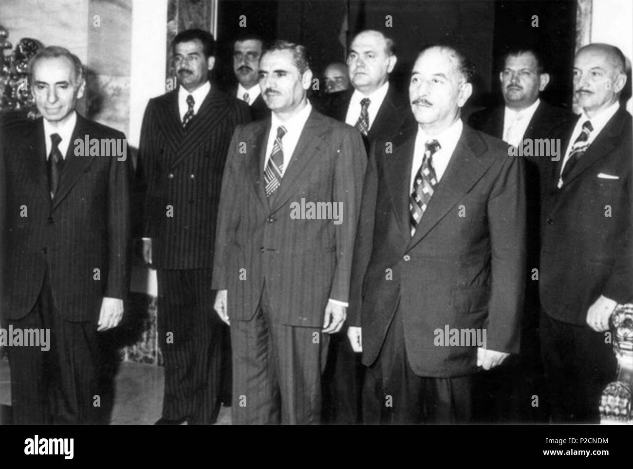 . English: Members of the National Command of the Arab Socialist Ba'th Party (Iraqi wing): Party founder and General Secretary Michel Aflaq (left), Iraqi Vice president Saddam Hussein (second line), Assistant General Secretary Shibli al-Ayssami (mid left), Iraqi president Ahmad Hasan al-Bakr (mid right) and others . between 1968 and 1979 (around 1974). Unknown 5 Baath National Command Stock Photo