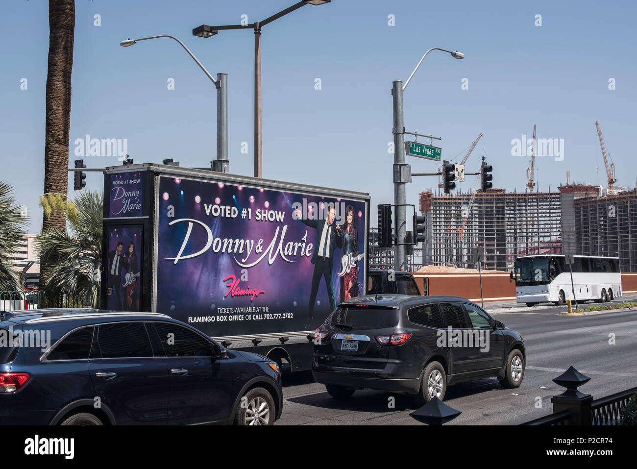 Donny & Marie Osmond vehicle billboard driving up and down las Vegas boulevard advertising their sell out show to tourists in Las Vegas Stock Photo