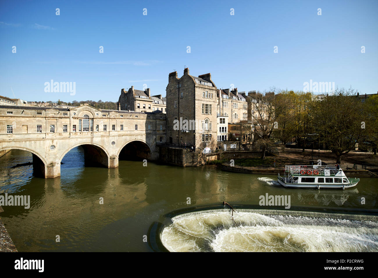 The pulteney bridge pulteney weir on the river avon in Bath city centre ...
