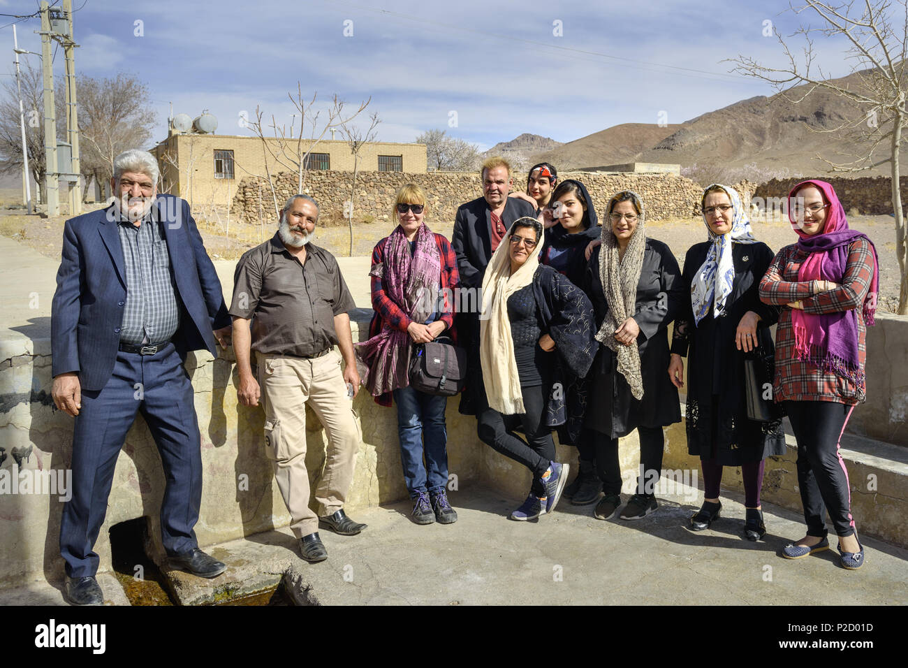 Isfahan province, Iran - March 22, 2018: Iranian big family with tourist in the village. Iran Stock Photo