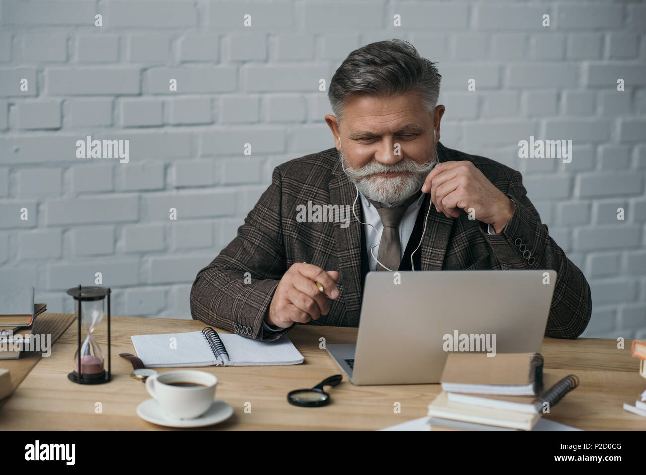happy senior writer working with laptop Stock Photo - Alamy