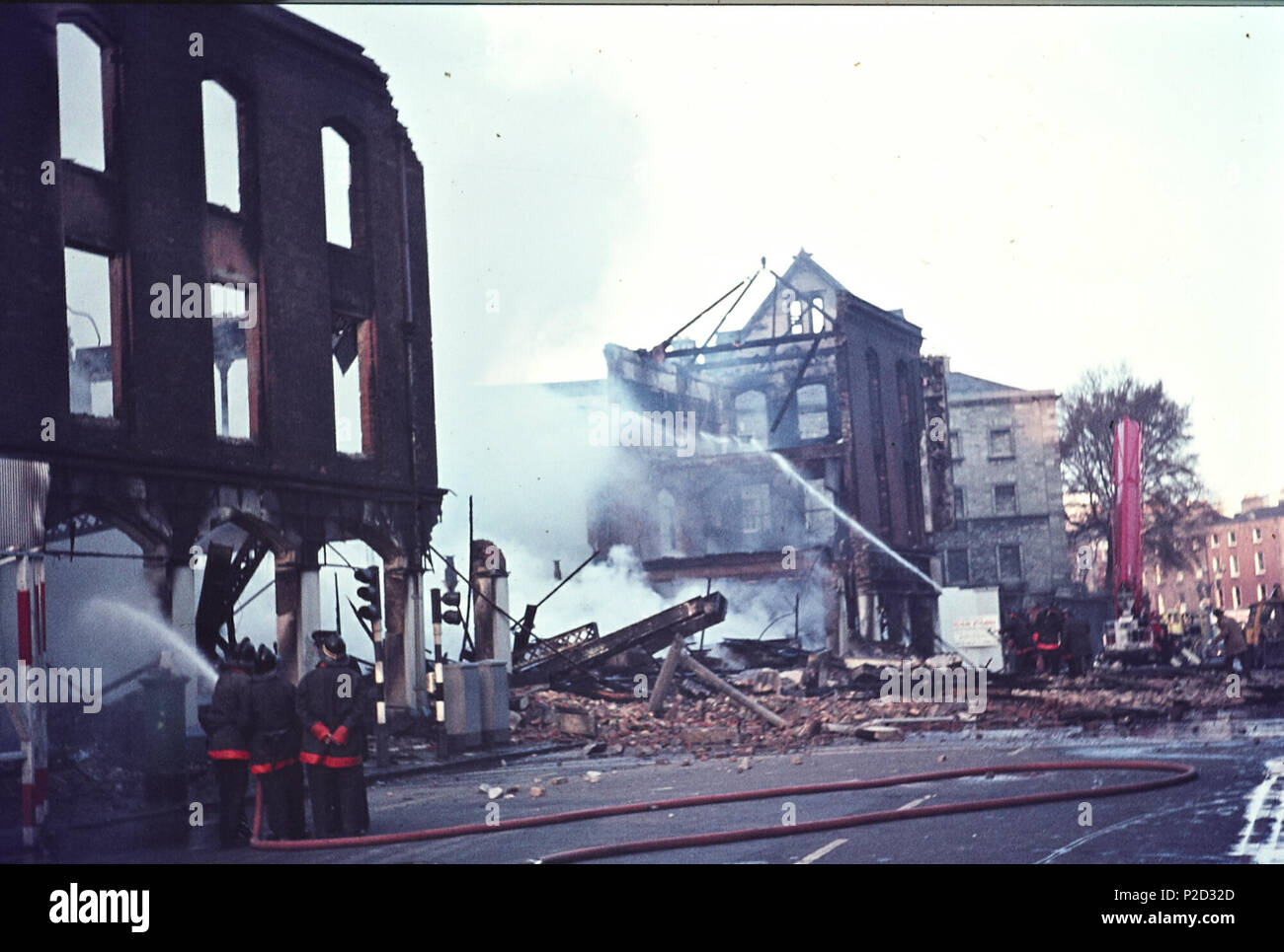 . The aftermath of a huge fire at Thomas McKenzie & Sons Ltd. on Pearse Street, Dublin, luckily situated just opposite Tara Street Fire Station. This report is from the front page of the Irish Times on the following day, Friday 10 April 1970: 'A serious congestion of traffic was experienced throughout the day in central Dublin yesterday following the fire which destroyed the entire three-storied hardware store of Thomas McKenzie and Sons, Ltd., at Pearse street shortly after 5 a.m. ... The blaze was the worst experienced by crews of Dublin Fire Brigade in five years, according to the city's ch Stock Photo