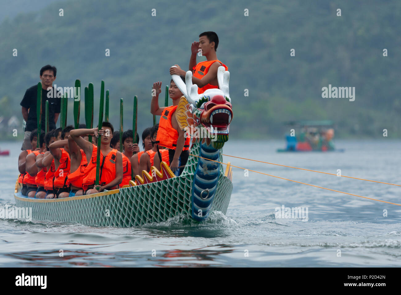 Dragon Boat Festival, rowing team competitors, drummer and flag catcher