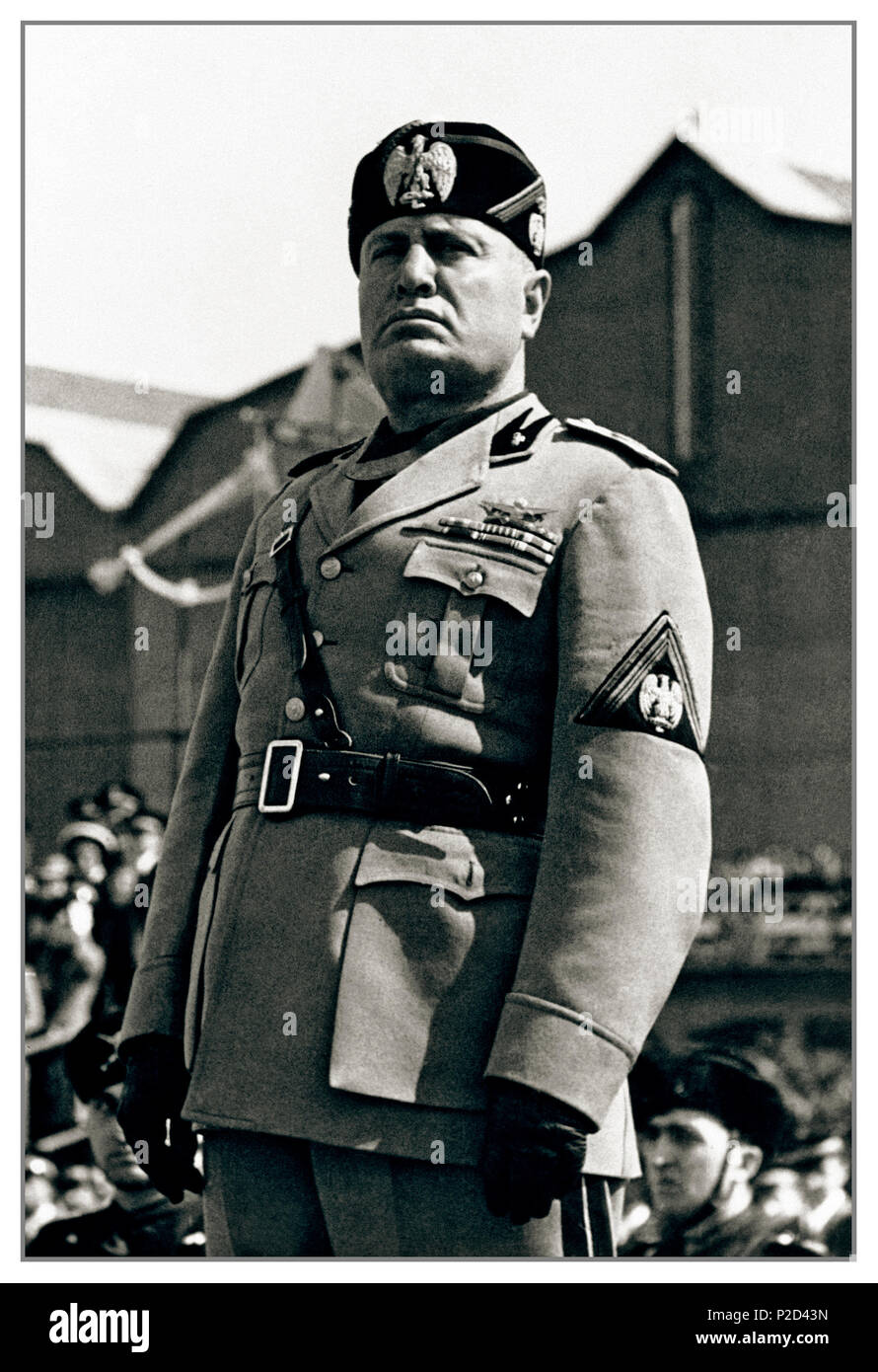 MUSSOLINI UNIFORM PODIUM Vintage WW2 image of Benito Amilcare Andrea Mussolini IL DUCE an Italian politician, journalist and the leader of the National Fascist party, ruling the country as a Prime Minister from 1922 to 1943 - Constitutionally until 1925 when he dropped all pretense of democracy and ruled as dictator. He made a crucial and fatal mistake of becoming part of the 'Axis of Evil' with Adolph Hitler In World War II Stock Photo