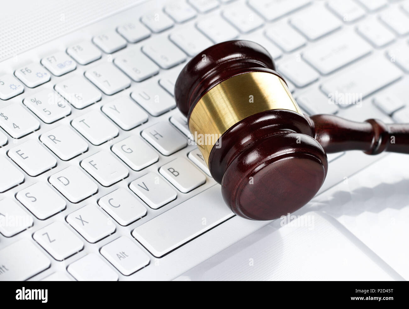 Wooden gavel on the computer keyboard, auction concept Stock Photo