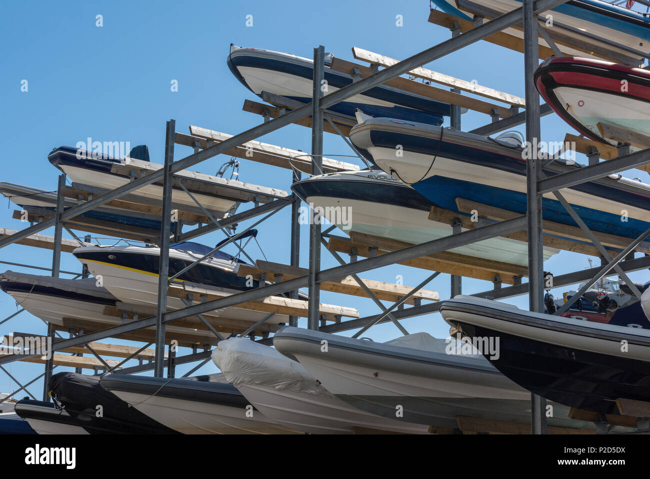 ribs and other day boats in a storage rack on different levels. stored