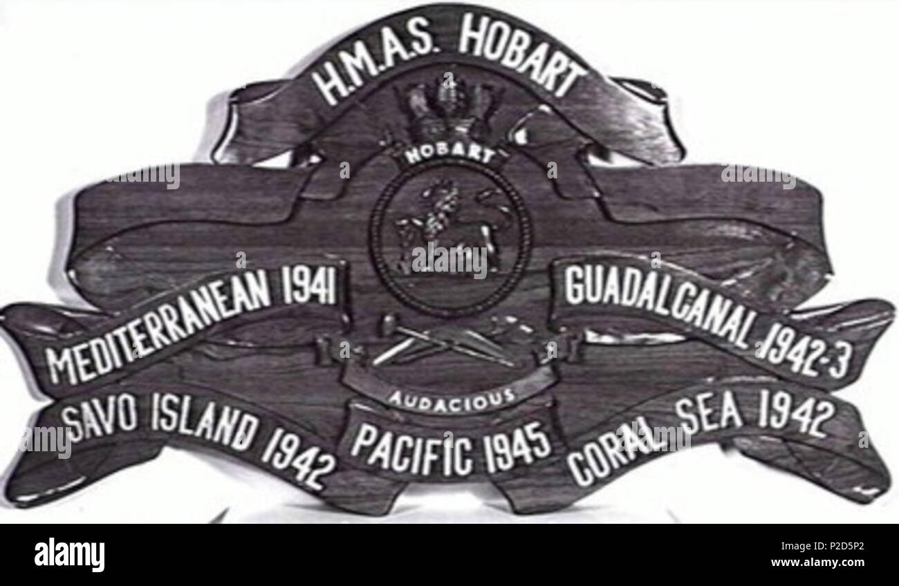 . AWM caption: 'BATTLE HONOURS BOARD OF HMAS HOBART (I) DEPICTING THE SHIP'S BATTLE HONOURS AND BADGE.' Cropped from the original to remove black borders and watermark. Not given. Photographer not identified 25 HMAS Hobart battle board Stock Photo