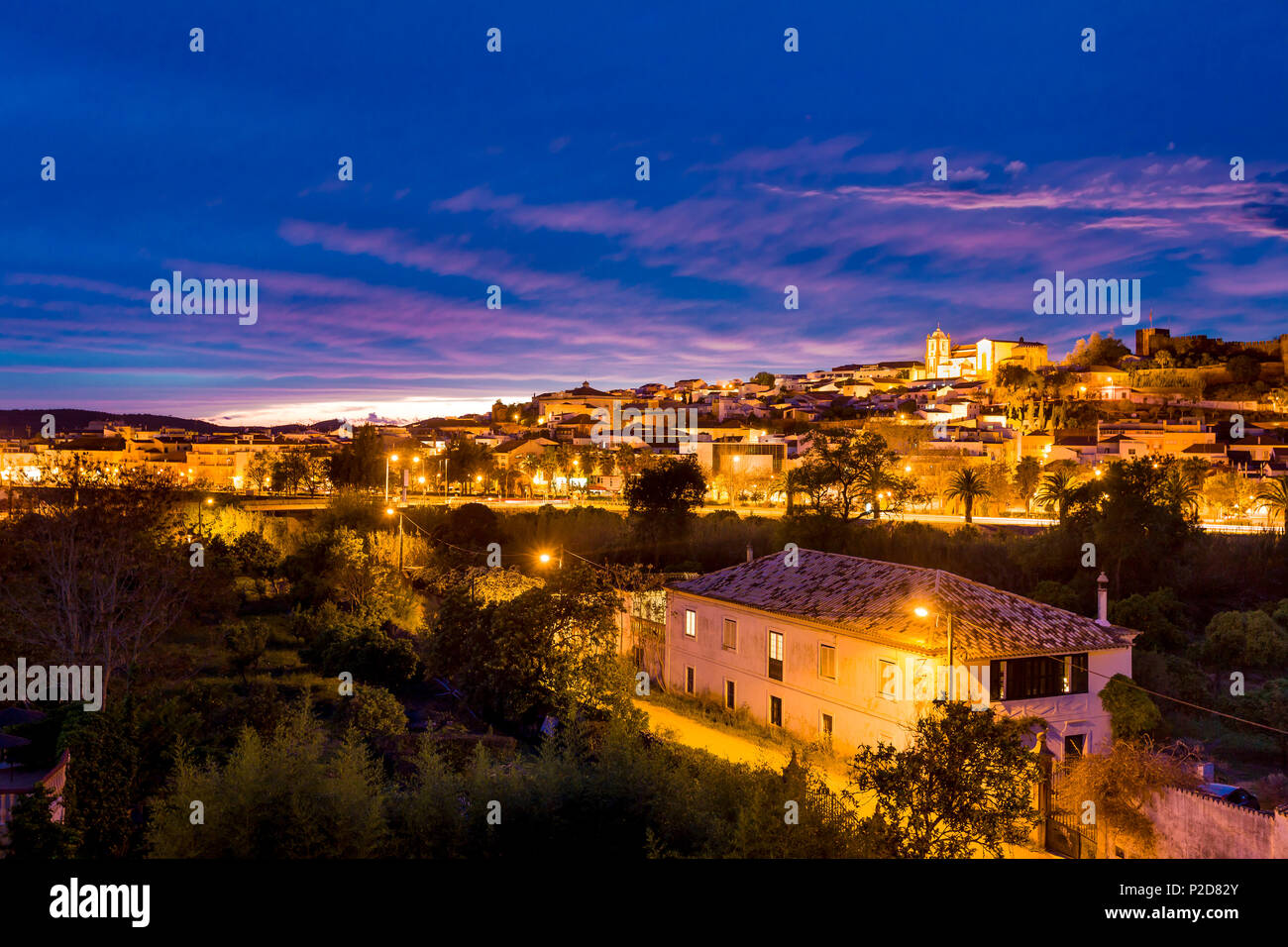 View towards old town, castle and cathedral at twilight, Silves, Algarve, Portugal Stock Photo
