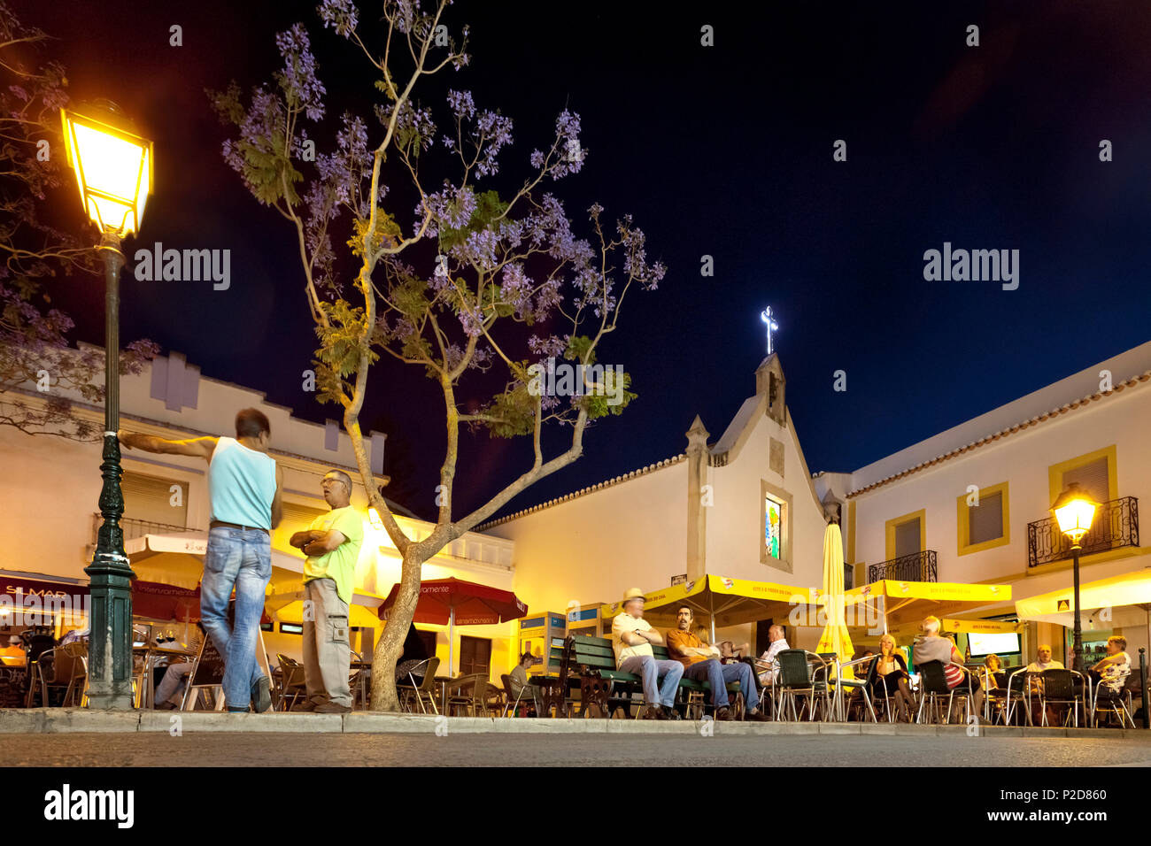 Old town at twilight, Cafe on the village square, Alvor, Algarve, Portugal Stock Photo