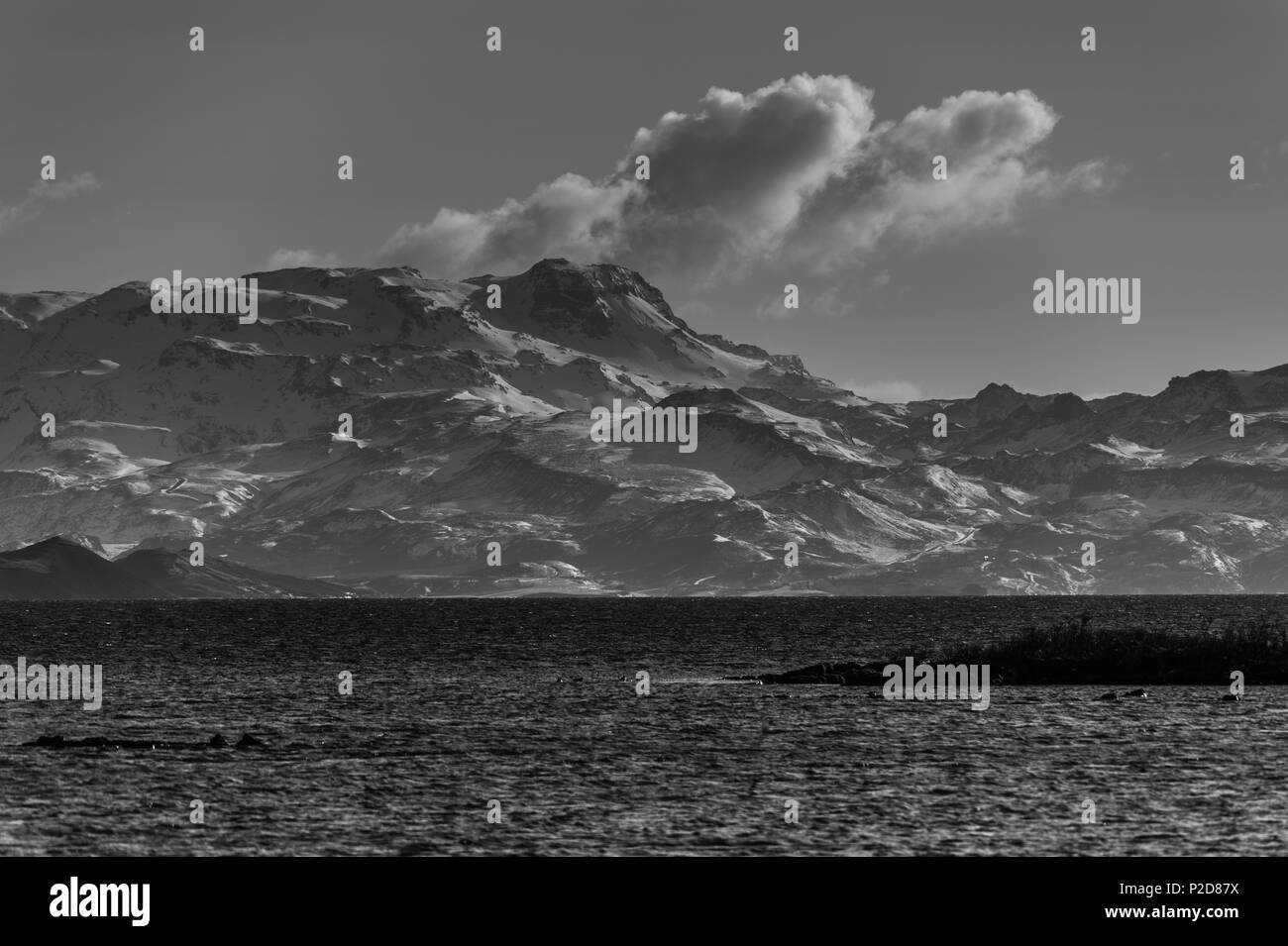 Monochrome mountain formation at the shore of thingvallavatn lake in thingevellir national park, iceland april 2018 Stock Photo