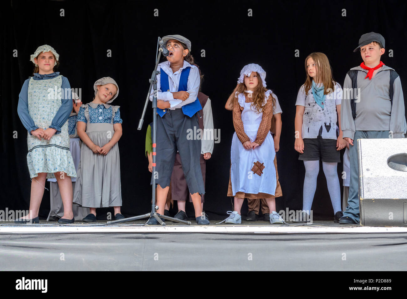Children from the Pauline Quirke academy of performing arts performing songs from oliver at the Rochester Dickens festival Stock Photo