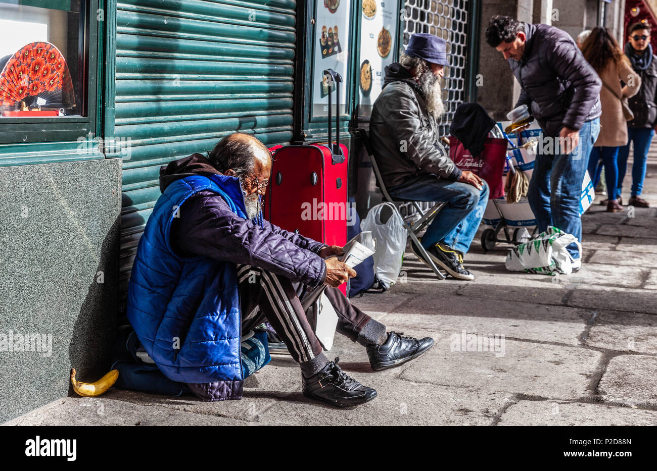 Homeless immigrants by Plaza Mayor, Madrid, Spain. Stock Photo