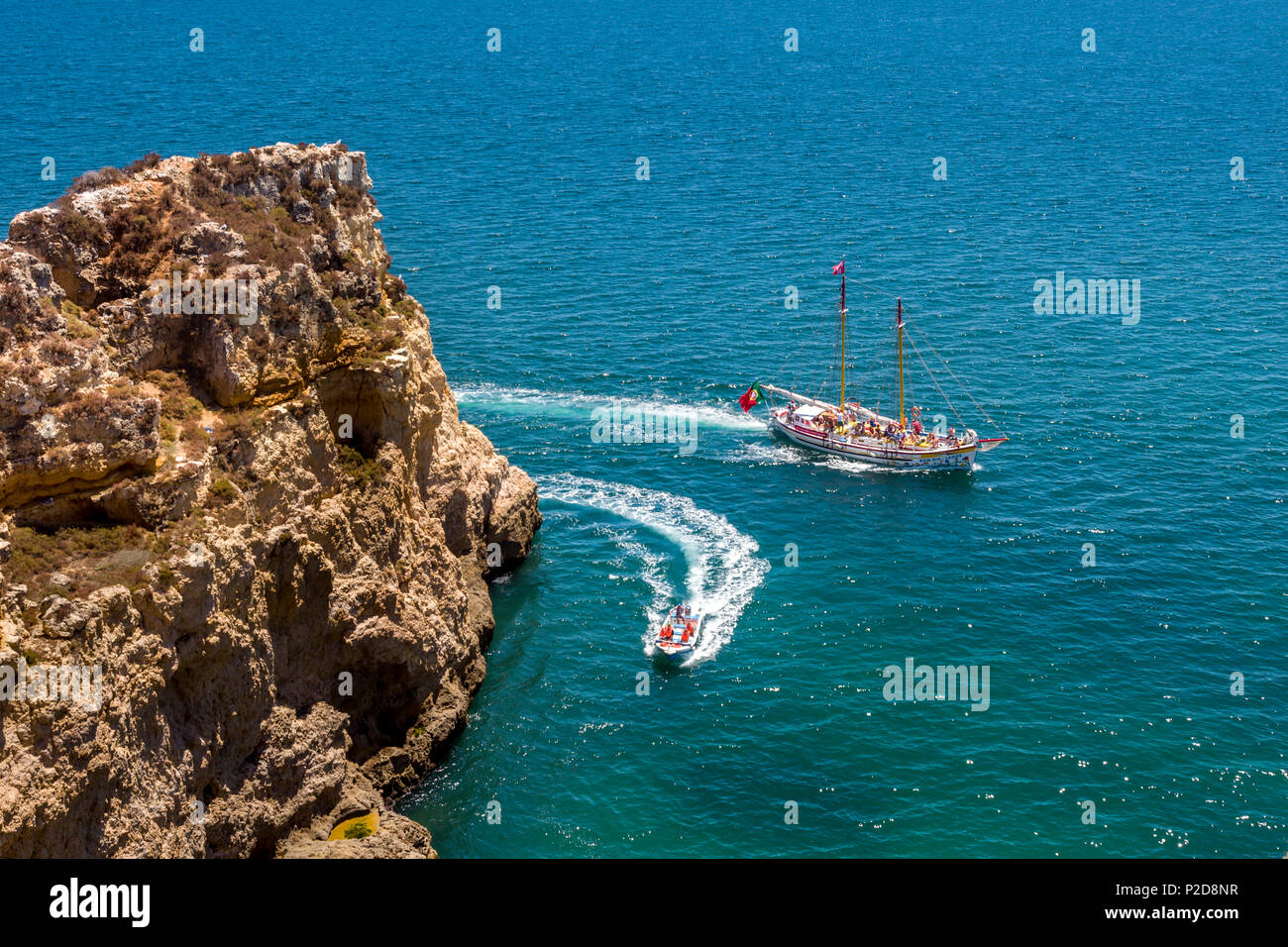 Boats at Ponta de Piedade, Rocky coastline, Lagos, Algarve, Portugal Stock Photo