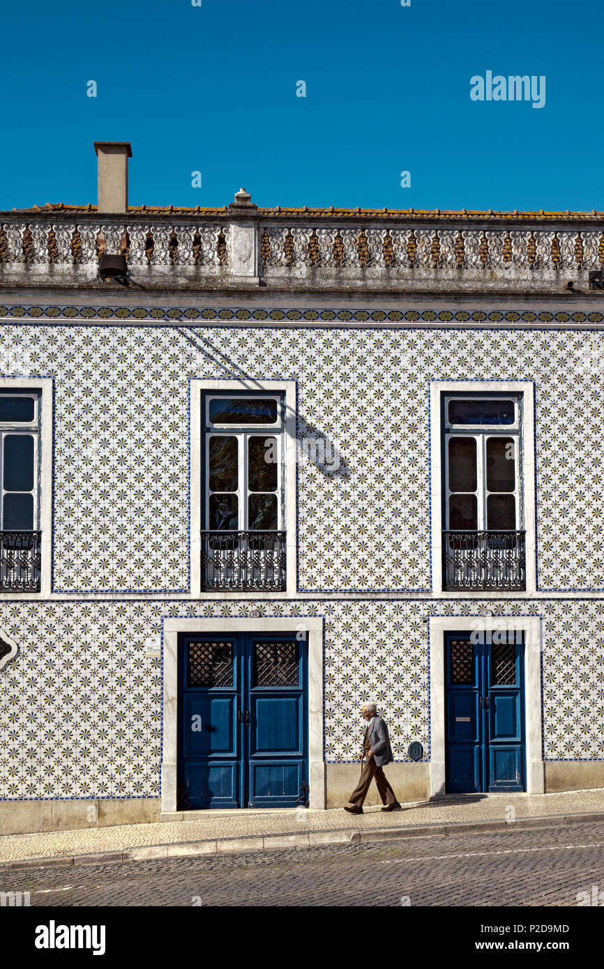Old man in front of tiled house, Beja, Alentejo, Portugal Stock Photo