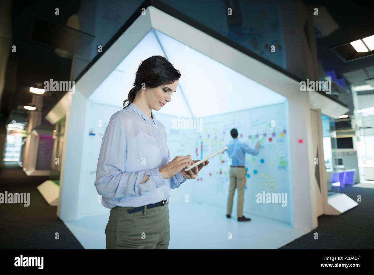 Female executive using digital tablet Stock Photo
