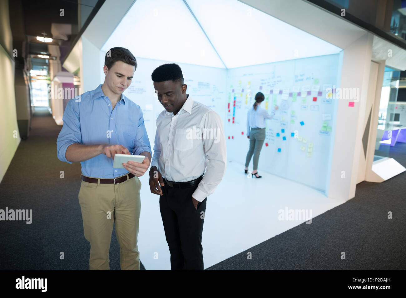 Male executives using digital tablet Stock Photo
