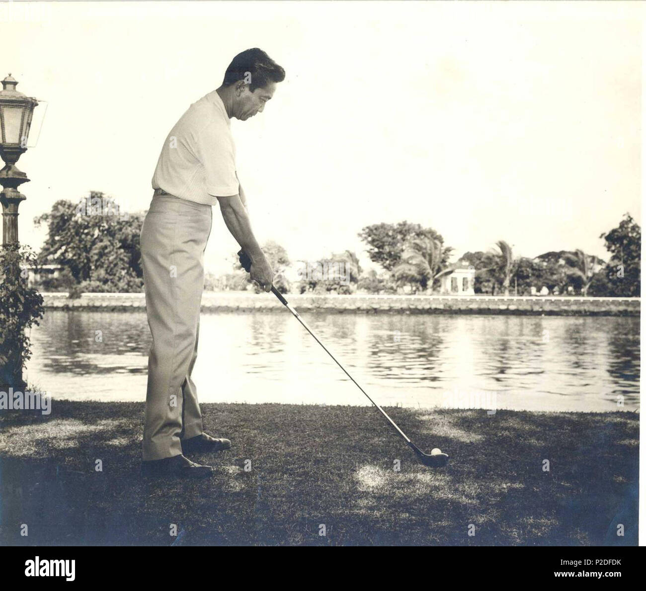 . English: Philippine President Ferdinand E. Marcos playing golf in Malacañan Park . 23 May 2015. Malacañang Palace 43 President Ferdinand Marcos playing golf Stock Photo